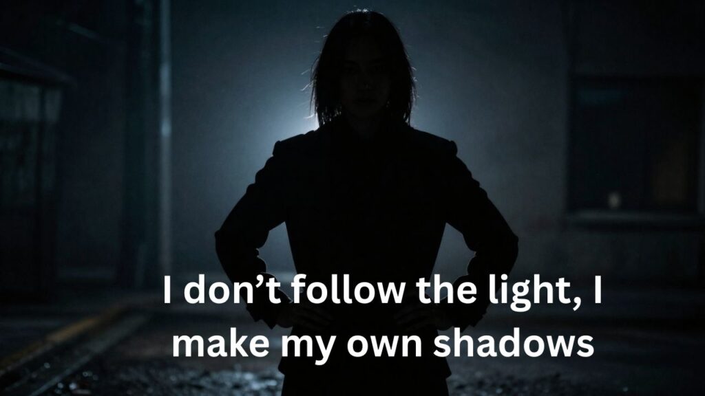 Person standing in shadows with a confident posture and piercing gaze, exuding boldness and a strong attitude – ideal for Dark Captions with Strong Attitude